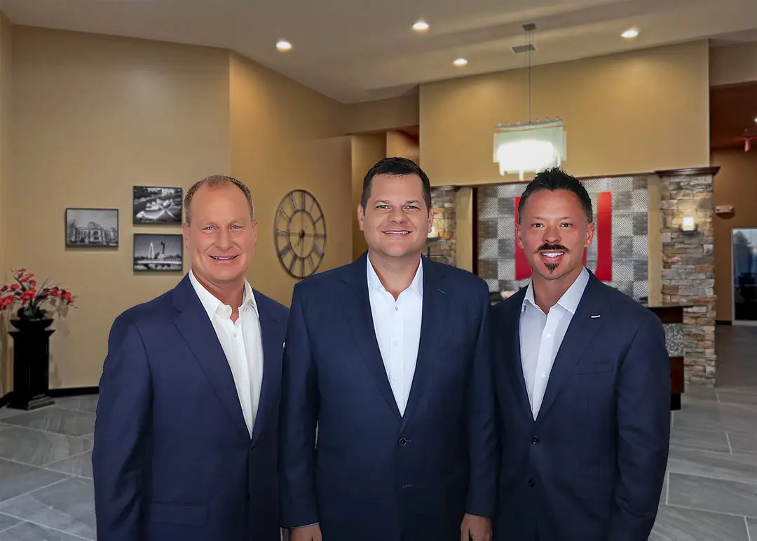 Dustin Richard and Cody standing in Witchita office front lobby